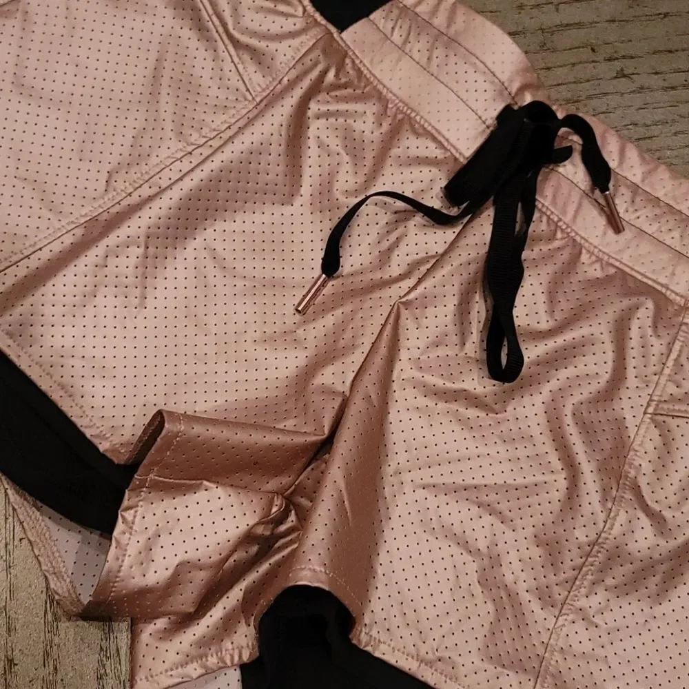Cala by Carie Underwood 2 in 1 Rose gold shorts XS